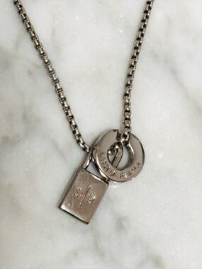 LORO PIANA Circle & Lock Pendant Silver Tone